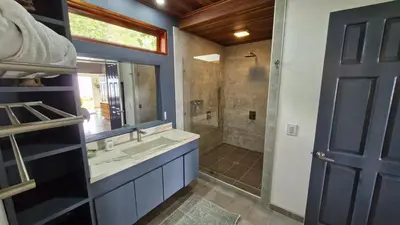 a bathroom with a sink and a shower at Casa Finca Madrid Mazzitelli in Támesis