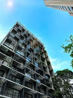 a tall building with balconies on the side of it at Indust in Medellín