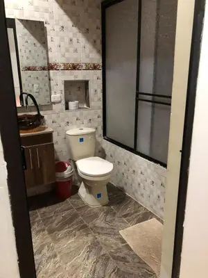 a bathroom with a toilet and a sink at Casa santorini in Puerto Triunfo