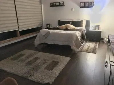 a bedroom with a large bed and a rug at Athos Hotel Boutique in Bolivia