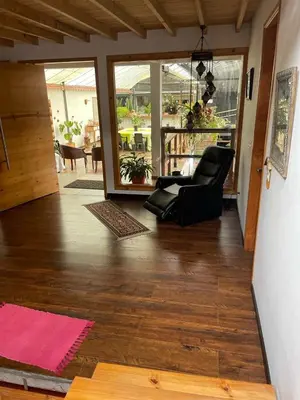 a living room with a couch and a chair at Athos Hotel Boutique in Bolivia