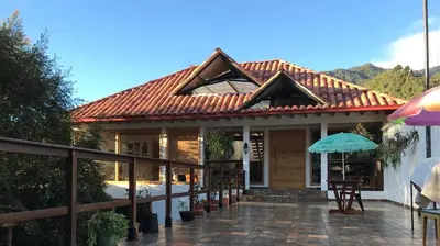 a house with a tiled roof and a patio at Athos Hotel Boutique in Bolivia