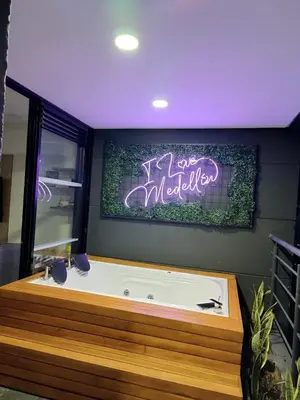 a bath tub with a sign that reads its made up at Penthouse Estadio Medellín in Medellín