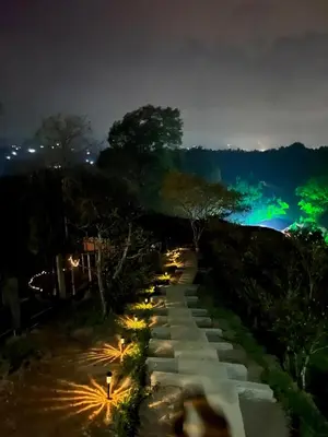 a stone path at night with lights on it at Ecoedén glamping in Guatapé