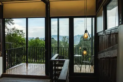 a screened porch with a view of the mountains at Refined cabin, panoramic views, steps from Jericó in Jericó