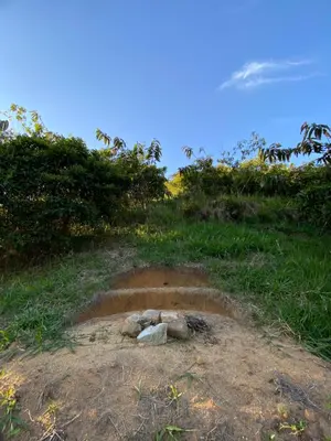 a hole in the ground on the side of a hill at Macuá, Refugio del bosque in San Rafael