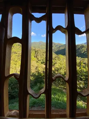 a view from a window of a mountain view at Macuá, Refugio del bosque in San Rafael