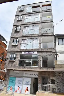 a tall building with windows on the side of it at Cómodo apartament tipo loft en El Peñol in El Peñol