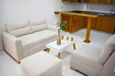 a living room with a couch and a table at Cómodo apartament tipo loft en El Peñol in El Peñol