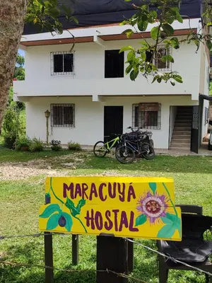 a sign in front of a house at Maracuya Hostel in San Rafael
