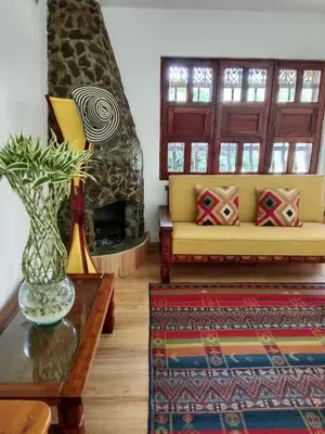 a living room with a couch and a fireplace at Hermosa Villa La Laja Rionegro in Rionegro