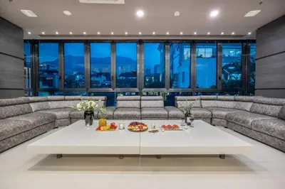 a living room with couches and a table with food on it at Europa Suites Medellin in Medellín