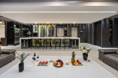 a living room with a table with food on it at Europa Suites Medellin in Medellín