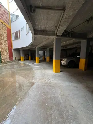 a parking garage with a car parked in it at BISÁU Hotel in Ruiosucio