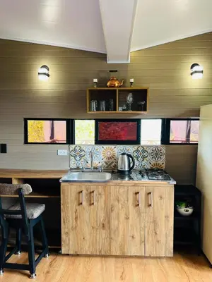 a kitchen with a sink and a counter top at Eco Lodge Glamping in Guatapé