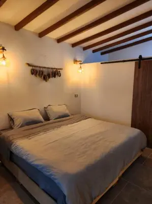 a bedroom with a large bed in a room at Apartaestudio en El Poblado in Medellín