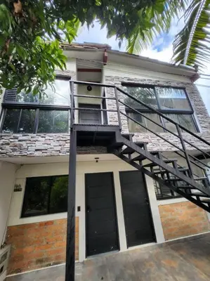 a house with a fire ladder in front of it at Apartaestudio en El Poblado in Medellín