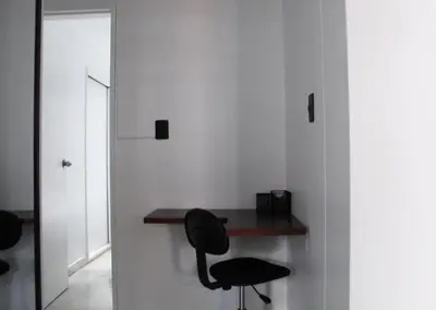 a desk in a room with a black chair at Apartamento zona rosa El poblado 202 in Medellín