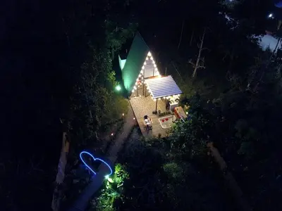 an overhead view of a house at night with lights at Cabaña in Sopetran