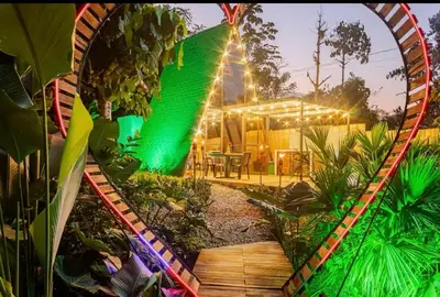 a mirror reflection of a garden with a house at Cabaña in Sopetran