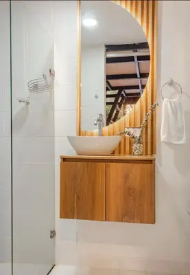 a bathroom with a sink and a mirror at Cabaña in Sopetran