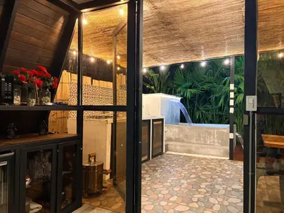 a view of a room with a patio through a glass door at Cabaña in Sopetran