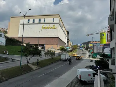 a view of a street with a building and cars at Barcelona in Manizales