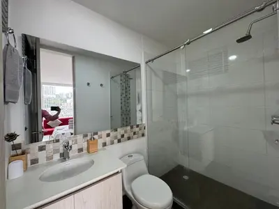 a bathroom with a toilet and a sink and a shower at Barcelona in Manizales