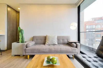 a living room with a couch and a table at The place you need in Poblado-Medellin 1103 in Medellín