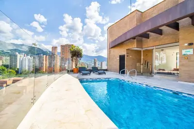 a swimming pool on the side of a building at The place you need in Poblado-Medellin 1103 in Medellín