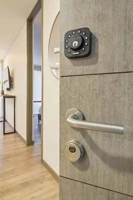 a wooden door with a door handle and a door at Ideal place in el Poblado, Medellin in Medellín