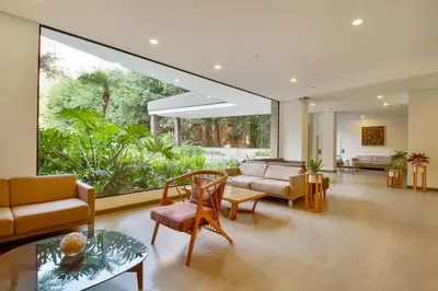 a living room filled with furniture and a large window at Ideal place in el Poblado, Medellin in Medellín