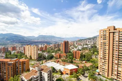 an aerial view of a city with tall buildings at Ideal place in el Poblado, Medellin in Medellín