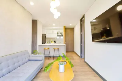 a living room with a couch and a table at The perfect stay in Medellín - 904 in Medellín