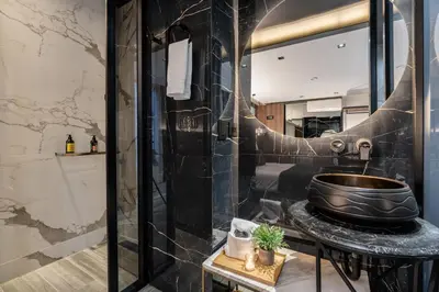 a bathroom with a sink and a mirror at Tribeca Suites Medellin in Medellín