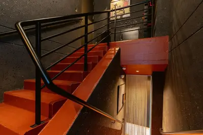 a set of stairs in a building with orange steps at Primavera Luxury Apartments Medellin in Medellín