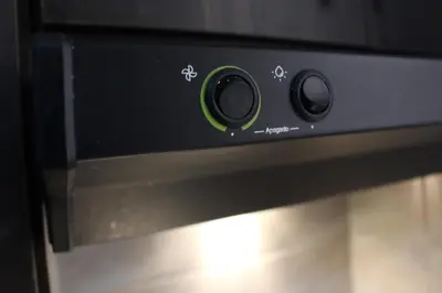 a close up of an oven with a green knob at CASA ESTADIO MEDELLIN Apartamentos Turisticos renovados y modernos para Familias, Grupos o Delegaciones Deportivas - Sector Laureles-Estadio in Medellín