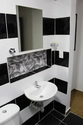 a bathroom with a sink and a toilet and a mirror at CASA ESTADIO MEDELLIN Apartamentos Turisticos renovados y modernos para Familias, Grupos o Delegaciones Deportivas - Sector Laureles-Estadio in Medellín