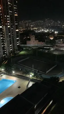 a view of a swimming pool at night at Luxurious Stay in Bello