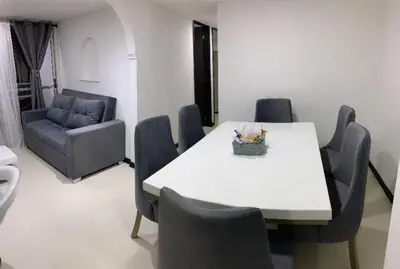 a dining room with a white table and chairs at Luxurious Stay in Bello