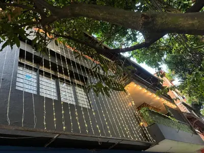a building with a fence in front of it at Casa Raizal in Envigado