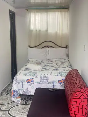 a bedroom with a bed with a castle blanket at La posada de Martha in Marulanda