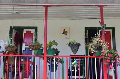 a red fence with potted plants on it at La posada de Martha in Marulanda