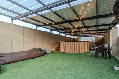 a large room with a large couch and a table at Balcón en Laureles, AC, Piscina, Estacionamiento 601 in Medellín