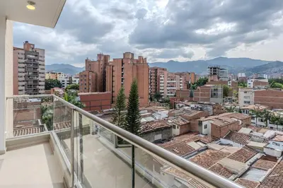 a balcony with a view of a city at Balcón en Laureles, AC, Piscina, Estacionamiento 601 in Medellín
