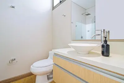 a bathroom with a white toilet and a sink at The place to stay in Medellin 802 in Medellín