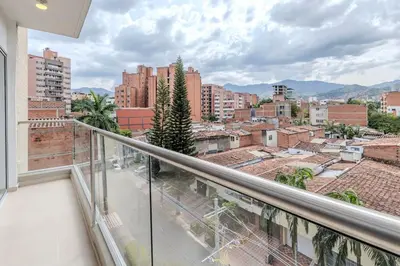 a balcony with a view of a city at Lindo apartamento en Laureles con piscina 501 in Medellín