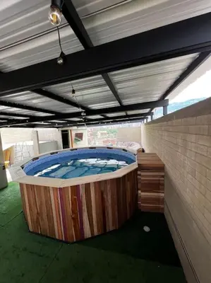 a large hot tub in the middle of a room at Lindo apartamento en Laureles con piscina 501 in Medellín