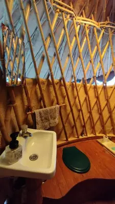 a bathroom with a white sink in a room at Mandi Wasi - Alojamiento Compartido in San Rafael