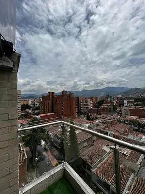 a view of a city from the balcony of a building at Apartamento centrico en Laureles con piscina 301 in Medellín